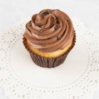 Vanilla-N-Chocolate Cupcake · Vanilla bean cake with chocolate buttercream topped with chocolate curls.