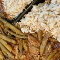 Green Beans And Lamb · Tender pieces of lamb sautéed in olive oil w/ green beans & tomato sauce, served w/ rice.