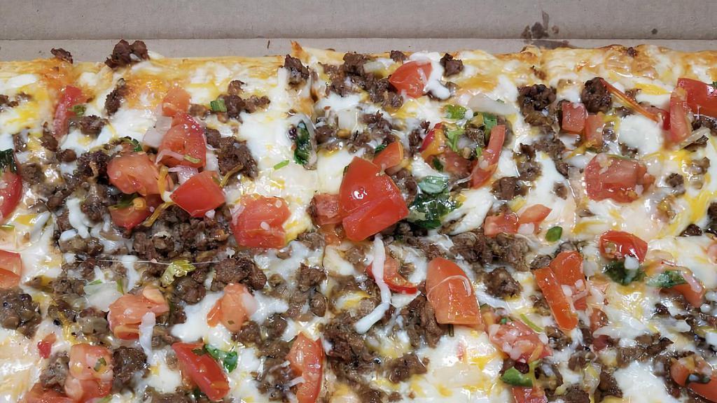 Fiestada Taco Pizza · Pillowy flatbread, salsa-ranch sauce, signature queso blend, pico de gallo and your choice of meat. Served with sour cream and salsa. Serves 2-4 people