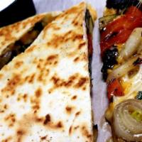 Grilled Veggie Quesadilla · This is a folded quesadilla loaded with grilled zucchini, portobello mushrooms, red bell pep...