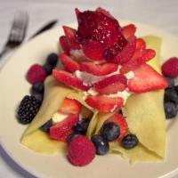 Berry Crepes · Filled  and  topped  with  fresh  seasonal  berries, whipped  cream  and homemade strawberry...