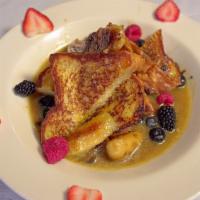 Banana French Toast · Two  slices  of  our  house  made  white  bread  dipped  in  our  French   toast  batter  an...