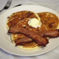 Bacon Pancakes · Three  pancakes  with  house  made  bacon  pieces  topped  with  two slices  of  bacon.
