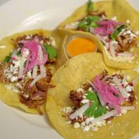 Tacos · Choice of Beef barbacoa, braised pork, or  chicken.

Topped with Queso Fresco, cilantro, rad...