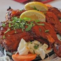 Tandoori Chicken · Chicken marinated in yogurt with blend of colorful Indian herb's spices and roasted in the c...