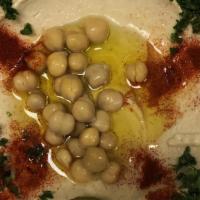 Hummus With Pita Bread · Chickpeas with sesame base and lemon juice. Served with fresh pita bread.