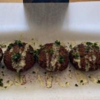 Falafel · Seasoned chickpeas mixed with parsley, garlic, and onions then deep-fried. Served with our h...