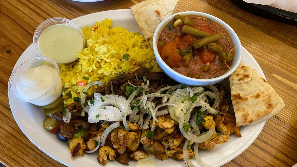 Chicken Shawarma · Slow-cooked and seasoned chicken served with our homemade garlic sauce and fresh pita bread. Served with Greek salad, rice, and green beans.