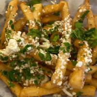Greek Fries · Our fresh French Fries topped with our Greek dressing, Feta cheese, and parsley.