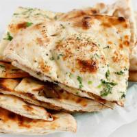 Plain Naan · White bread baked in a clay oven with or without butter.