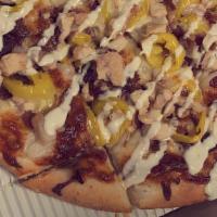 Chicken Bacon Ranch Pizza · Olive oil and garlic sauce topped with provolone cheese, bacon, chicken, and onions, with ba...