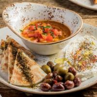 Middle Eastern · Foule mudammas, labna, olives, za'atar, and toasted pita.