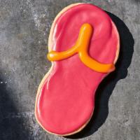 Flip Flop Cookie · 440 Cal. Freshly baked all-butter shortbread cookie shaped like a flip flop and decorated wi...