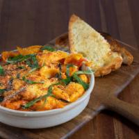 Conchiglie Al Forno · baked shells, tomato cream, ricotta, mozzarella, sausage