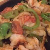 Shrimp Fajitas · Indulge in one of our fajitas filled with your favorite items sizzled up with onions tomatoe...