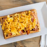 Morning Glory · A fluffy waffle topped with scrambled eggs, bacon or sausage and tillamock cheddar cheese. F...