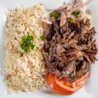Meat Shawarma · Shaving that was marinated and slow-roasted served with tomatoes, onions and tahini sauce.