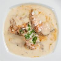 Creamy Mushroom Chicken · Sautéed chicken with mushroom and our special cream sauce.