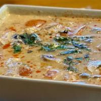 Tom Yam Knook Soup · Shrimp, peppers, tamarind, coconut milk, chili paste, cilantro, mushrooms, tomatoes and lemo...