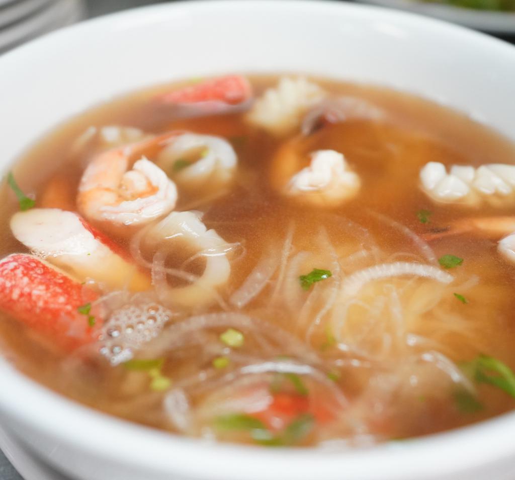 Seafood Noodle Soup · Rice noodle, squid, crabs, shrimps, beansprouts, basil, cilantro, lime, hoisin, sriracha.