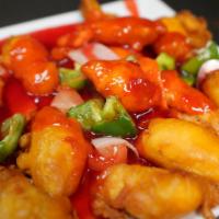 Sweet & Sour Chicken · Breaded chicken, green peppers, onions, carrots, pineapple. Served with white rice.