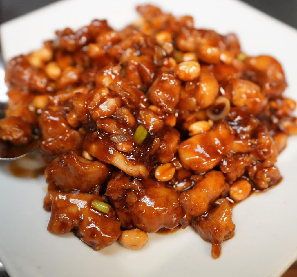 Kung Pao Chicken · Spicy. Chicken, peanuts, onions, roasted peppers.  Served with white rice.