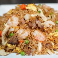 House Fried Rice · Has Chicken, Pork, Shrimp, peas, carrots, onions, eggs.