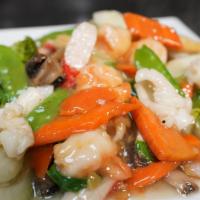 Seafood Chow Fun · Shrimps, squid, scallops, peapods, Bok Choy, baby corn, carrots, mushroom, toss-fried in whi...