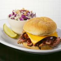 The Trojan · Smoked chicken, spiced brisket, sauteed onion, Chef's BBQ sauce on kaiser roll.