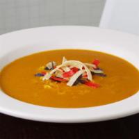 Tortilla Soup · Crispy tri-colored tortilla strips and shredded cheddar cheese.