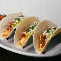 Street Tacos · Three soft corn or flour tortillas, your choice of meat topped with red onion, cilantro. roa...