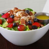 Harvest Salad · Salad greens, spinach, berries, chicken breast, feta, toasted pecans and dates with a honey ...