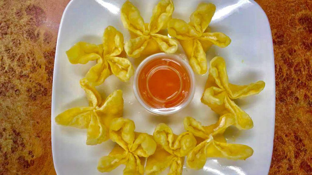 Crab Rangoon (8) 蟹角 · Cream Cheese Inside. Come with a small cup of Happy Garden House Special Made Yellow Rangoon Sauce.