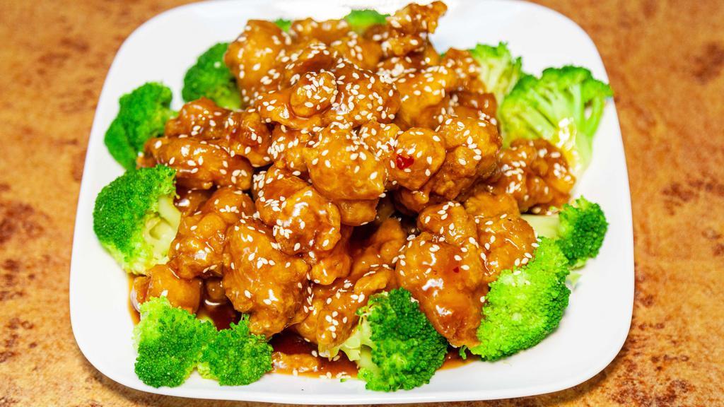 Sesame Chicken 芝麻鸡 · Chunks crispy of chicken in brown sauce with sesame seeds on top.