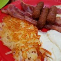 Jeff'S Big Breakfast · Two pancakes or biscuit and gravy or toast with three eggs, your choice of hash browns or ho...