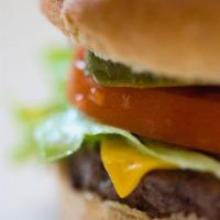 Cheeseburger · Our prime 1/3 pound Angus burger patty with American cheese. Served with lettuce, tomato and...