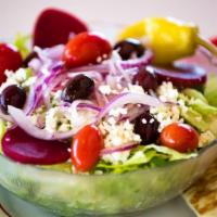 Greek Salad · Barrel aged feta cheese, sliced red onions, cherry tomatoes, Kalamata olives, beet slices an...