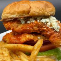 Buffalo Chicken Sandwich · Crispy hand-breaded chicken tossed in buffalo sauce, topped with blue cheese crumbles, lettu...