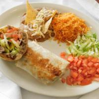 Chimichanga Burrito Dinner · Deep fried flour tortilla with cheese, lettuce, tomatoes and your choice meat. Includes rice...