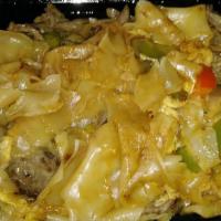 Drunken Noodles · Thai style wild fresh rice noodles sauteed with eggs, bell peppers, basil leaves, and Thai g...
