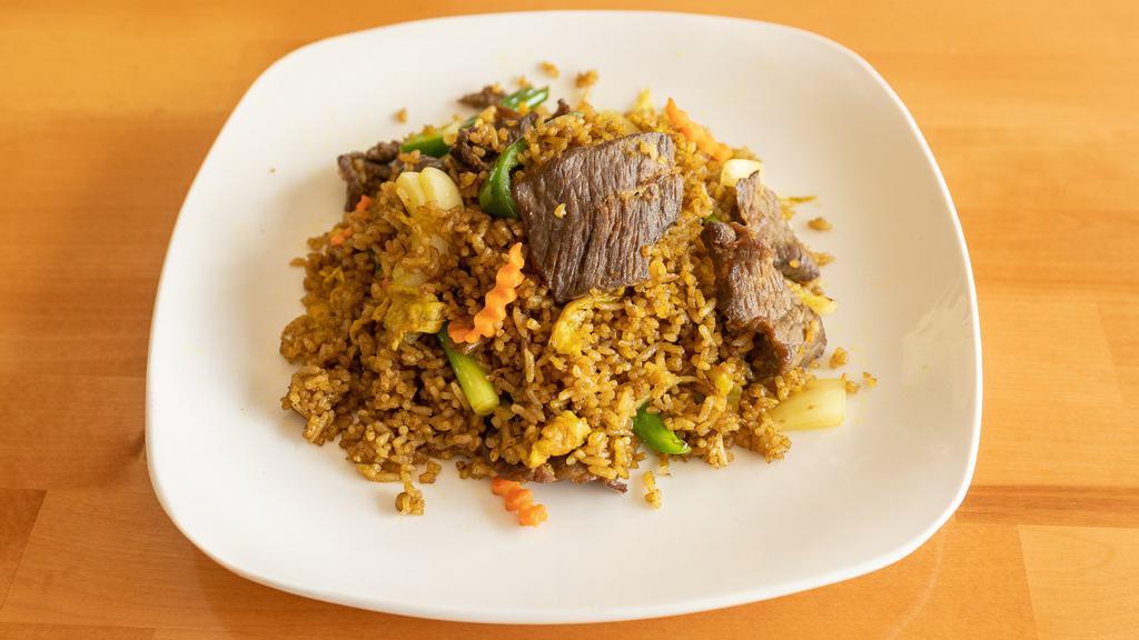 House Fried Rice · Stir Fried with steamed white rice, eggs, white onions, peas, and carrots.