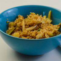 Pineapple Fried Rice · Stir-fried with steamed white rice, pineapple, eggs, white onions, peas, carrots, and cashew...