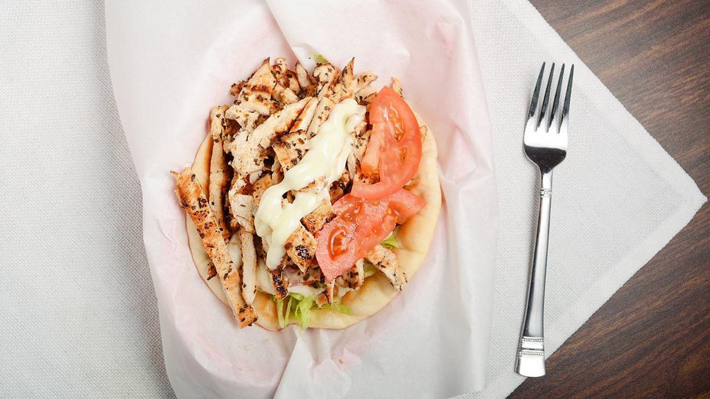 Chicken Pita · One of our favorites...Loaded with delicious seasoned chicken breast, sliced and wrapped in a warm fluffy pita bread. Topped with mayo, lettuce, and tomato slices.