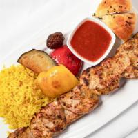 Chicken Kebab · Marinated and grilled boneless chicken cooked over an open flame. Served with fresh garden s...