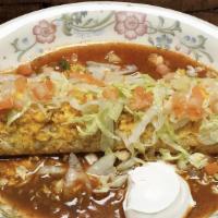 Macho Burrito · A super burrito filled with rice, beans, cheese and your choice of meat filling. Covered wit...