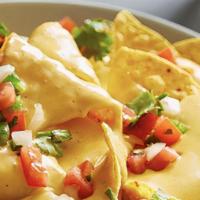 Nachos Cheese (Large) · Add chicken, ground beef, shredded beef or chorizo and guacamole or sour cream for an additi...