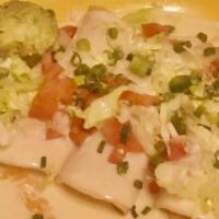 Enchiladas Adelitas · Four enchiladas: one chicken, one shredded beef, one ground beef and one cheese. Topped with...
