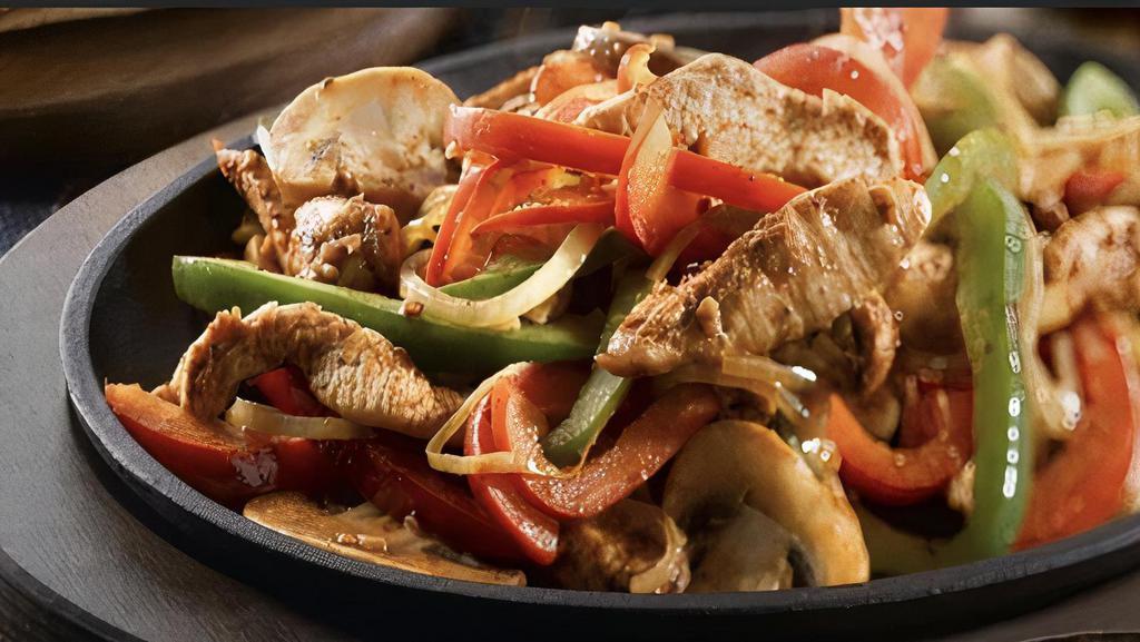 Chicken Fajita · A sizzling grilled dish with sauteed onions and green peppers. served with rice beans guacamole sour cream pico de gallo and cheese.