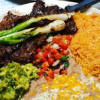 Carne Asada · Charcoal grilled skirt steak served with guacamole and pico de gallo.
