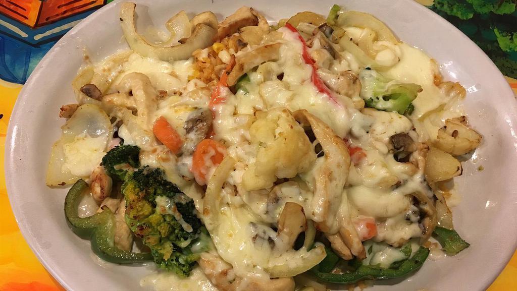 Mexican Stir-Fry · A bed of rice topped with sautéed chicken, broccoli, carrots, cauliflower, zucchini, mushrooms and green pepper. Topped with melted jack cheese.